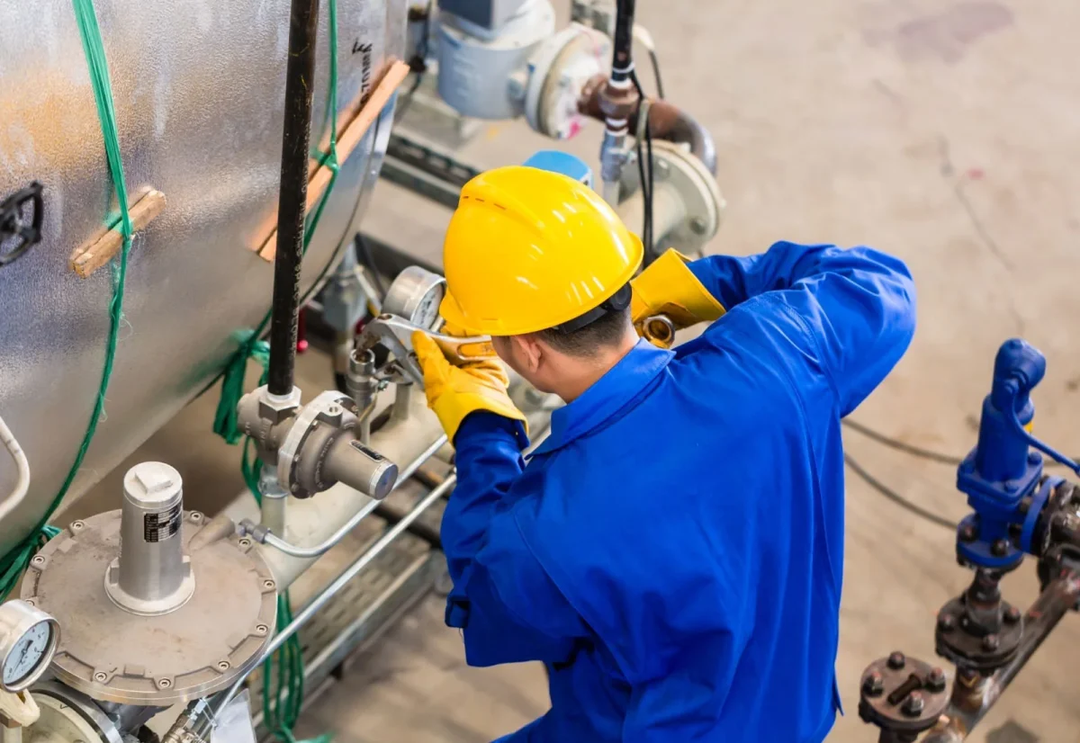 Representative technician inspecting plant equipment